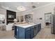 An open-concept kitchen featuring a large island, stainless steel appliances, and seamless access to the living area at 136 Starlit Way, Myrtle Beach, SC 29579