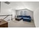 Cozy loft space featuring plush blue sectional sofa and carpet at 136 Starlit Way, Myrtle Beach, SC 29579