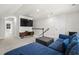 Spacious loft featuring a plush blue sectional sofa, TV, and carpet at 136 Starlit Way, Myrtle Beach, SC 29579