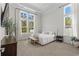 Serene main bedroom with abundant natural light, neutral tones, and elegant curtains, creating a relaxing retreat at 136 Starlit Way, Myrtle Beach, SC 29579