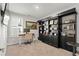 Carpeted home office with modern shelving, a light desk, and neutral paint at 136 Starlit Way, Myrtle Beach, SC 29579