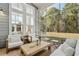 Inviting screened patio with comfortable seating, offering a serene outdoor space perfect for relaxation and gatherings at 136 Starlit Way, Myrtle Beach, SC 29579