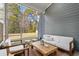 Cozy outdoor patio featuring comfortable seating and views of the lush backyard, ideal for relaxing and entertaining at 136 Starlit Way, Myrtle Beach, SC 29579
