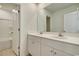 Bathroom with a double sink vanity, white cabinets, and a large mirror at 1369 Palm Springs Paloma Dr, Longs, SC 29568