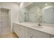 Well-lit bathroom featuring a double sink vanity, large mirror, and tiled floor at 1369 Palm Springs Paloma Dr, Longs, SC 29568