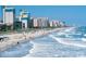 A beautiful view of the sandy beach and ocean, complete with sunshine and blue sky at 1369 Palm Springs Paloma Dr, Longs, SC 29568