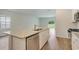 A modern kitchen island featuring granite countertops and stainless steel appliances at 1369 Palm Springs Paloma Dr, Longs, SC 29568