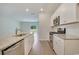 Modern kitchen featuring stainless steel appliances, granite countertops, and an open layout leading to the living area at 1369 Palm Springs Paloma Dr, Longs, SC 29568
