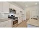 A modern kitchen featuring stainless steel appliances and granite countertops at 1369 Palm Springs Paloma Dr, Longs, SC 29568