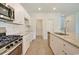 Kitchen featuring granite countertops, stainless steel appliances, and white cabinets at 1369 Palm Springs Paloma Dr, Longs, SC 29568