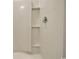 A shower with sleek fixtures and built-in shelving for storage at 1369 Palm Springs Paloma Dr, Longs, SC 29568