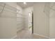 A walk-in closet with wire shelving that leads to a private bathroom at 1369 Palm Springs Paloma Dr, Longs, SC 29568