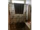 Bathroom featuring light-colored shower curtain and contrasting wall panel at 1372 Oakmont Ct., Murrells Inlet, SC 29576