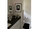 Cozy bathroom featuring neutral walls, art decor, and modern fixtures on dark countertops at 1372 Oakmont Ct., Murrells Inlet, SC 29576