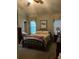 Inviting bedroom with neutral tones, featuring a comfortable bed, dresser, and windows with natural light at 1372 Oakmont Ct., Murrells Inlet, SC 29576