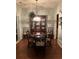 Elegant dining room showcasing a round table with chairs, a china cabinet, and classic chandelier at 1372 Oakmont Ct., Murrells Inlet, SC 29576