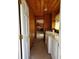 Hallway featuring a washer and dryer hookup and providing access to other rooms in the home at 1375 Kenny Jordan Rd, Tabor City, NC 28463