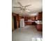 Spacious kitchen features wood cabinets, retro flooring and a white refrigerator at 1375 Kenny Jordan Rd, Tabor City, NC 28463