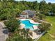 Aerial view of a community pool, surrounded by trees and a white fence at 1501 Ferney Dr., Conway, SC 29526