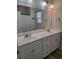 Bright bathroom featuring a double sink vanity with white countertops and plenty of storage at 1501 Ferney Dr., Conway, SC 29526
