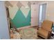 Playful bedroom featuring a whimsical mountain wall painting and comfortable seating at 1501 Ferney Dr., Conway, SC 29526