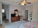 Bedroom showing connecting bathroom, fan, TV, and dresser at 1501 Ferney Dr., Conway, SC 29526