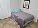 This bedroom features a bed with a gray blanket and two pillows and access to a closet at 1501 Ferney Dr., Conway, SC 29526