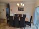 Inviting dining room features a contemporary chandelier and ample seating for memorable gatherings at 1501 Ferney Dr., Conway, SC 29526