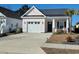 Inviting exterior of a one-story home featuring a well-kept lawn and driveway at 1501 Ferney Dr., Conway, SC 29526