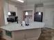 Modern kitchen featuring white cabinets, stainless steel appliances, and adjacent laundry area at 1501 Ferney Dr., Conway, SC 29526