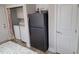 Convenient laundry area near kitchen includes washer, dryer, black refrigerator and extra storage at 1501 Ferney Dr., Conway, SC 29526