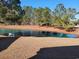 Scenic view of a pond with a fountain surrounded by trees and grass at 1501 Ferney Dr., Conway, SC 29526