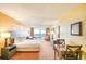 Comfortable bedroom with a balcony and ocean view, furnished with a cozy bed and a small dining table at 1501 S Ocean Blvd. # 1131, Myrtle Beach, SC 29577