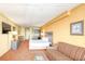 Comfortable living area featuring a cozy sofa, TV, kitchenette, and well-lit dining space at 1501 S Ocean Blvd. # 1131, Myrtle Beach, SC 29577
