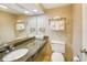Comfortable bathroom featuring a granite countertop vanity, commode, and an above-counter sink at 1501 S Ocean Blvd. # 844, Myrtle Beach, SC 29577