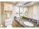 Comfortable bathroom featuring a granite countertop vanity, commode, and an above-counter sink at 1501 S Ocean Blvd. # 844, Myrtle Beach, SC 29577