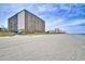 Large beachfront hotel with a striking facade and numerous balconies offering beautiful views of the ocean and sandy beach at 1501 S Ocean Blvd. # 844, Myrtle Beach, SC 29577
