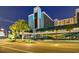 Night view of the Landmark Resort entrance, showcasing well-lit facades, palm trees, and inviting curbside appeal at 1501 S Ocean Blvd. # 844, Myrtle Beach, SC 29577