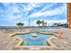 Outdoor pool with lounge chairs, a hot tub, and distant ocean view at 1501 S Ocean Blvd. # 844, Myrtle Beach, SC 29577