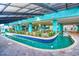 Inviting indoor pool area featuring a unique water feature and lush landscaping at 1501 S Ocean Blvd. # 844, Myrtle Beach, SC 29577