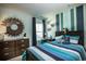 Nicely decorated bedroom with blue and white stripes on the wall at 1509 Seachase Way, North Myrtle Beach, SC 29582