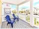 Enjoy the view of the neighborhood from this relaxing balcony furnished with two blue Adirondack chairs at 1614-B S Ocean Blvd., Surfside Beach, SC 29575