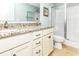 Bathroom featuring a double vanity with granite countertops and a shower at 1614-B S Ocean Blvd., Surfside Beach, SC 29575
