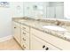 Bathroom featuring a double vanity with a granite countertop and a shower at 1614-B S Ocean Blvd., Surfside Beach, SC 29575
