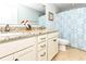 Bright bathroom features a double sink vanity, granite countertop, and custom shower curtain at 1614-B S Ocean Blvd., Surfside Beach, SC 29575