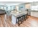 Open concept kitchen features granite countertops and an eat-in breakfast bar at 1614-B S Ocean Blvd., Surfside Beach, SC 29575