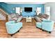 Bright living room with two sofas, two chairs, and a flat-screen TV at 1614-B S Ocean Blvd., Surfside Beach, SC 29575