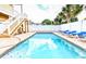 Backyard pool surrounded by brick patio, white fence, and lounge chairs at 1614-B S Ocean Blvd., Surfside Beach, SC 29575