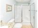 Bathroom featuring an enclosed white shower with glass doors at 1614-B S Ocean Blvd., Surfside Beach, SC 29575