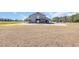 A large barn sits in an open field under a sunny sky at 1751 Nichols Hwy., Aynor, SC 29511
